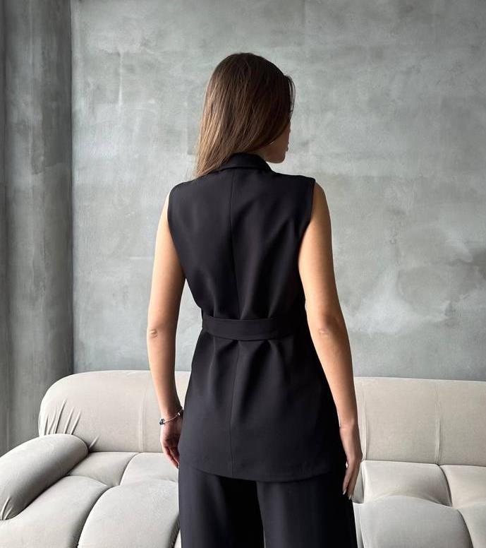 Long black cut blazer with a waist belt